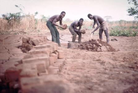 Men Gathering Mud for Bricks