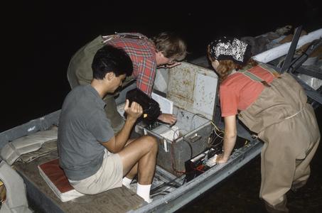 Adjusting the sonar in boat at night