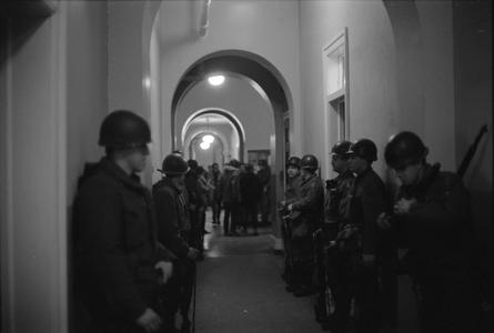 Soldiers standing in hallway