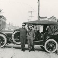 Two men with a car