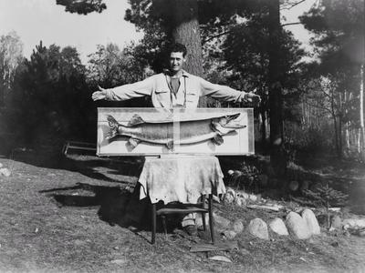 Ted Williams posing with record musky