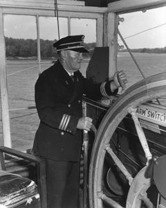 The captain at the wheel of the Idlewild