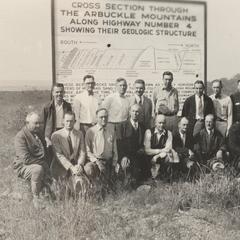 State geologist conference attendees at Arbuckle Mountains sign