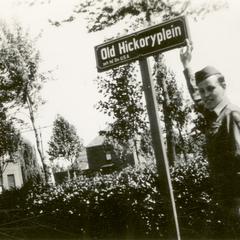 Ray Cunneen standing next to a sign for "Old Hickoryplein"