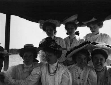 Group of women sitting on boat