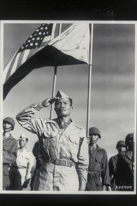 Sgt. Jose Calugas, Philippine Scout, and the first Filipino to be so honored, salutes as he receives the Medal of Honor, Manila, 1945