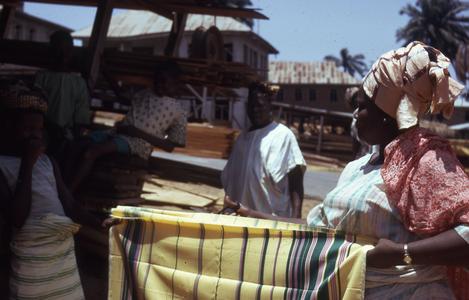 Nike's mother selling cloth at the Plank market