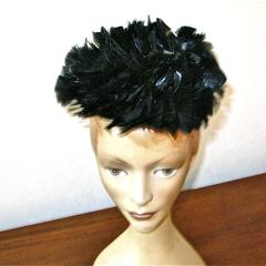 Pillbox hat with black feathers