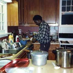 Agbo Folarin in kitchen at Trager's home