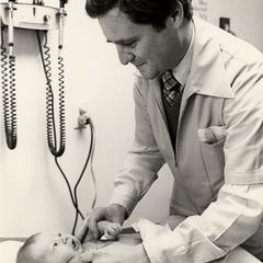 Doctor examines an infant