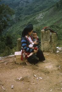 Ethnic Hmong woman nursing baby