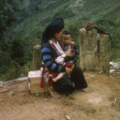 Ethnic Hmong woman nursing baby