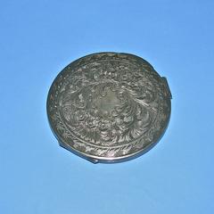 Round silver compact