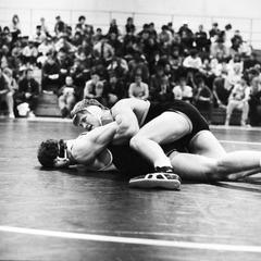 Two men in wrestling match
