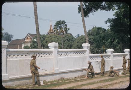 Soldiers painting palace wall