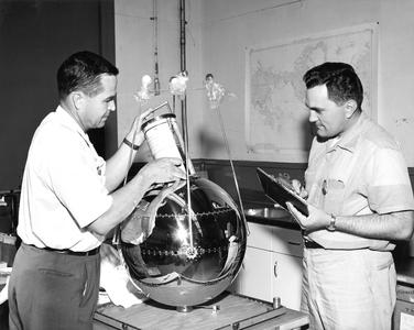 Mr. Moore and Mr. Martin with radiation balance satellite