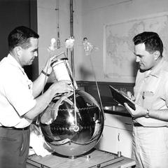 Mr. Moore and Mr. Martin with radiation balance satellite