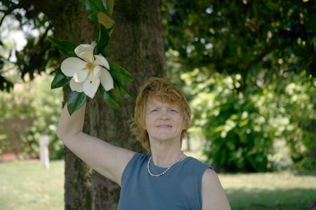 Magnolia grandiflora flower with Bonnie Clayton