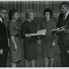 Five soloists highlighted in a performance of George Handel's Messiah, with the Stout Symphonic Singers and a community choir directed by Harold Cooke in the Harvey Hall Auditorium, December 15, 1963