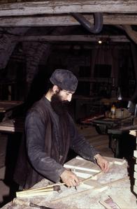 Monk preparing icon board at Xenophontos