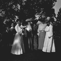 Group of women and children in yard at Leopold home in Burlington, Iowa