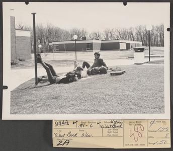 Students lying on ground outside
