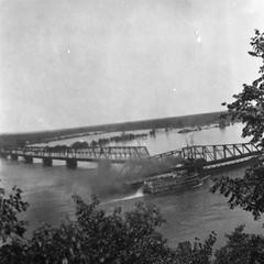 Steamship passing bridge over the Mississippi River