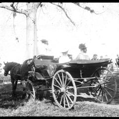 Mrs. Evans & Mrs. B. . . in carriage