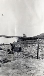 Steam shovel in crushed stone quarry