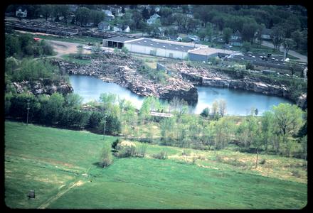 View of an urban rock quarry; probably a granite quarry in the Waupaca area of central Wisconsin