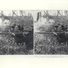 U.S. soldiers firing their rifles from a trench, 1899
