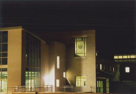 Exterior of Mary Ann Cofrin Hall at night