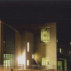 Exterior of Mary Ann Cofrin Hall at night