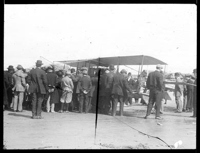 Crowd studying aeroplane