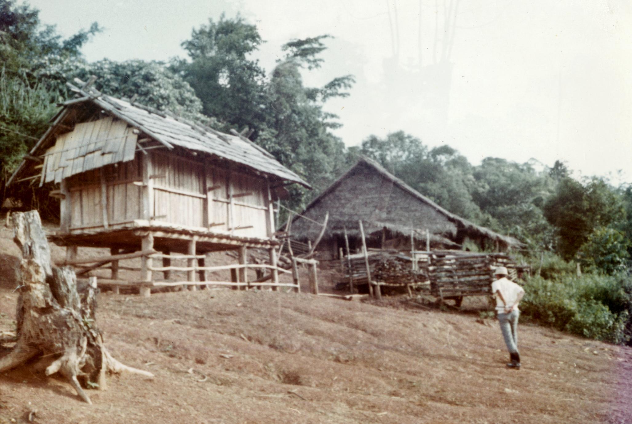 Rice storage buildings in a White Hmong village in Houa Khong Province