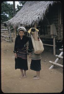 Kammu (Khmu') girls carrying sacks