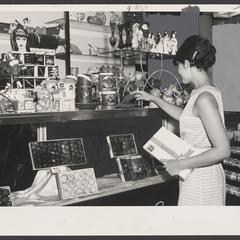 A woman views gifts on display in the candy department