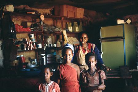 Rural Shopkeeper with Children in Store