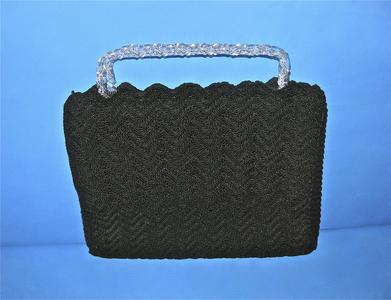 Structured cordeʼ bag in a zig zag pattern
