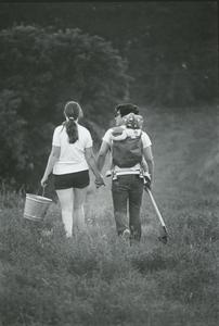 Student couple with child walking