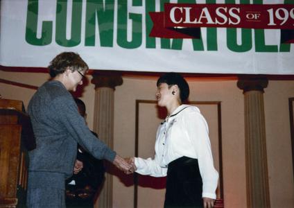Student receives an award at 1991 Multicultural Graduation reception