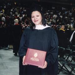 Student shows diploma at 2003 graduation