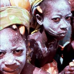 Girls at Ceremony with White Powder on Faces