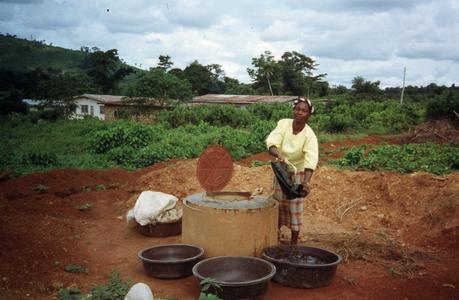 Woman getting water for processing gari