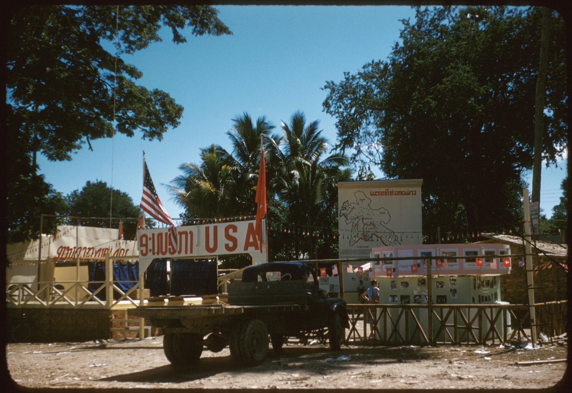 United States Operations Mission (USOM)-USIS booth, map of Laos in background