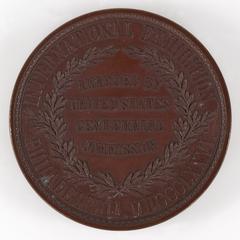 Object 1 titled Medal, text side