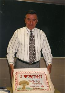 Biology professor Sami Saad with a personalized cake