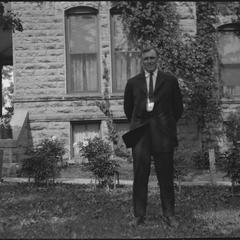 Man in front of building