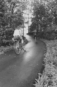 Two bicyclists on Cofrin Memorial Arboretum trails