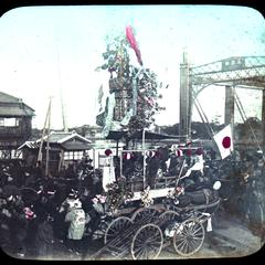A decorated cart passing by the side of Azumabashi